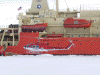 Helicopter taxi arriving at the edge of the ice shelf